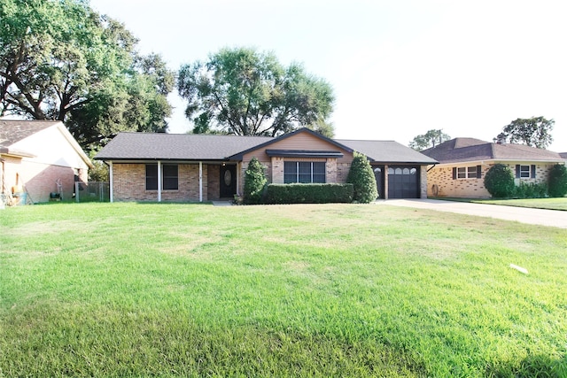 ranch-style home featuring a front yard and a garage