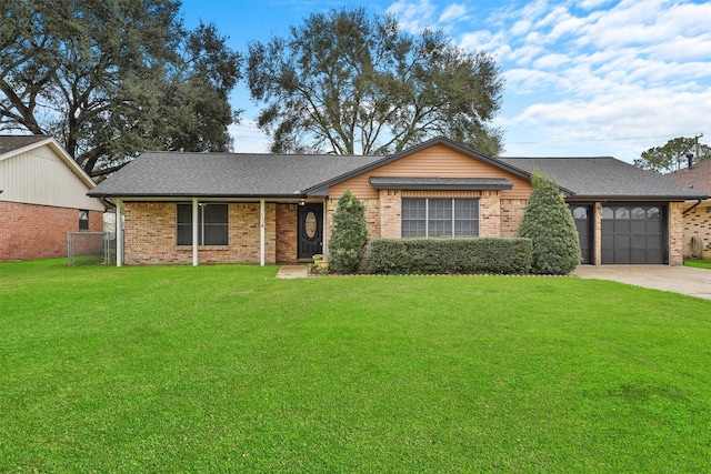 single story home featuring a garage and a front yard