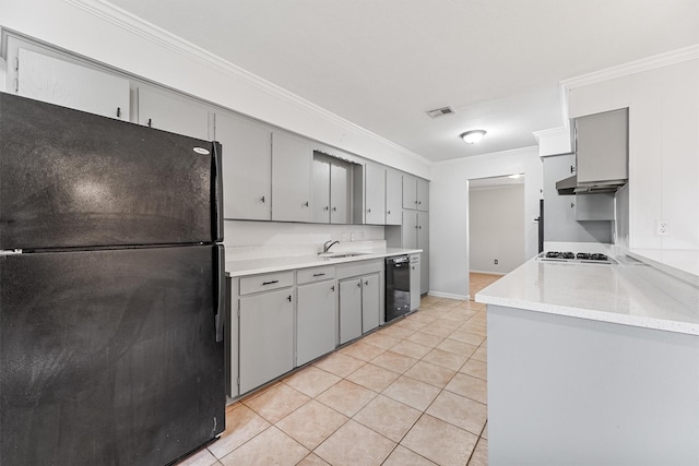 kitchen with crown molding, sink, light tile patterned floors, and black appliances