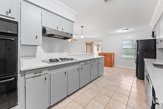 kitchen with crown molding, light tile patterned floors, hanging light fixtures, and black appliances