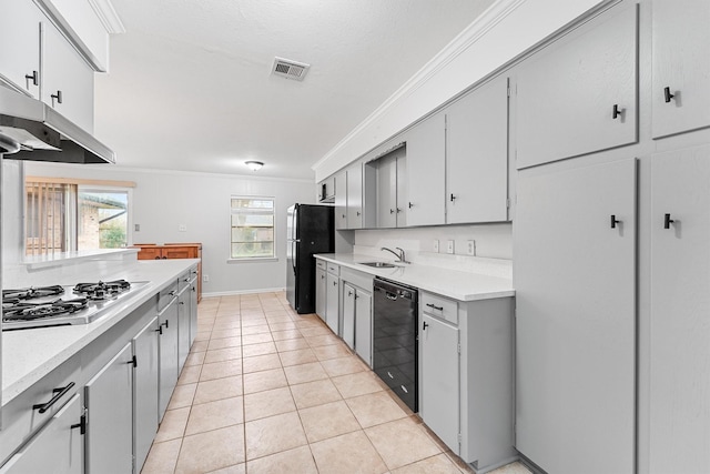 kitchen featuring sink, light tile patterned floors, ornamental molding, and black appliances