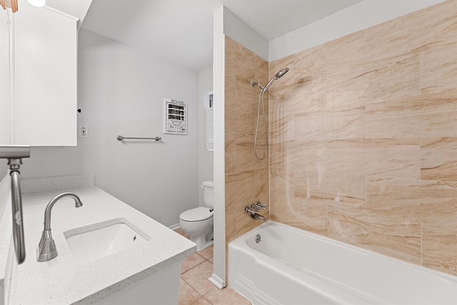 full bathroom featuring vanity, heating unit, tile patterned floors, toilet, and tiled shower / bath