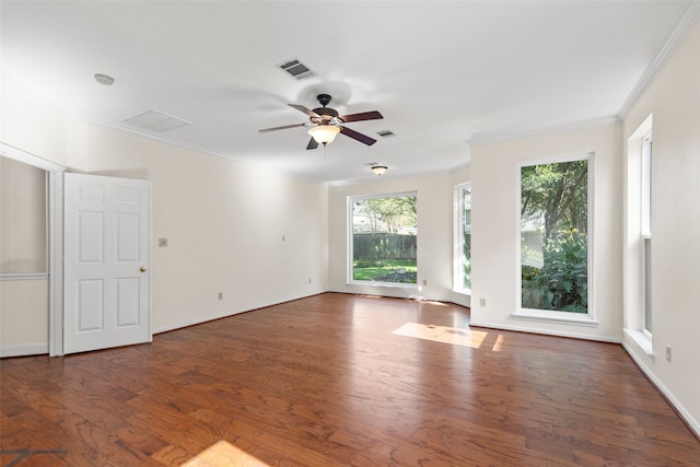 unfurnished living room with ceiling fan, dark hardwood / wood-style floors, and crown molding