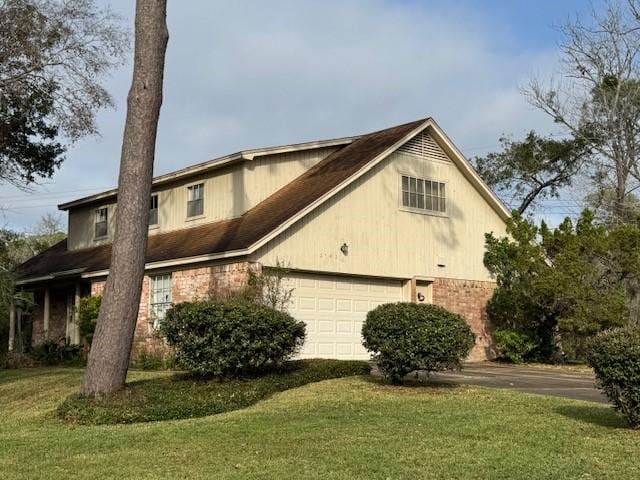 view of property exterior featuring a garage and a yard