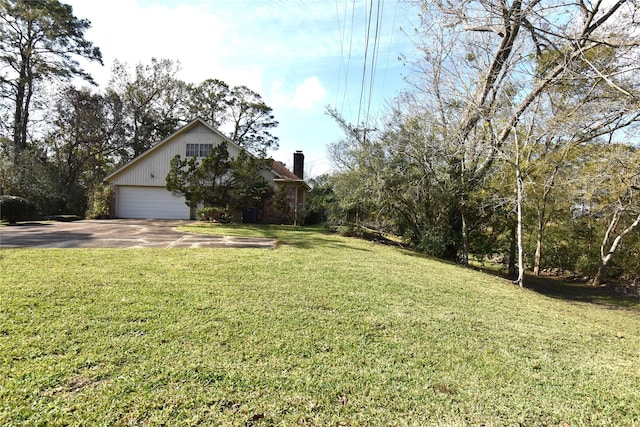 view of front of home with a front lawn and a garage