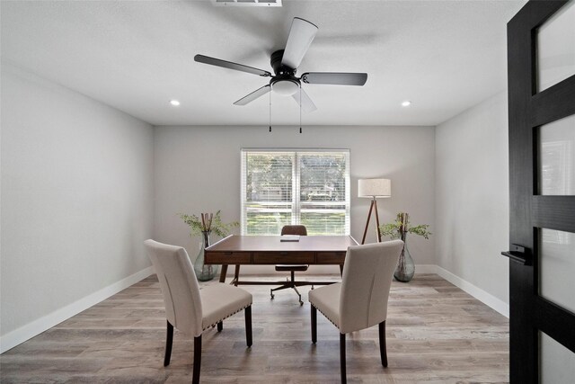 office featuring ceiling fan and light wood-type flooring