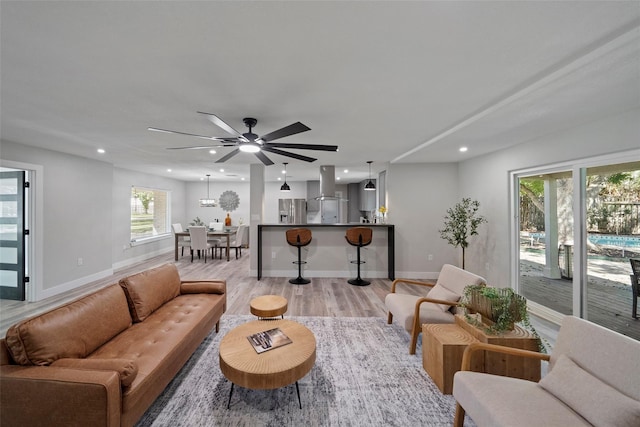 living room featuring light hardwood / wood-style flooring and plenty of natural light