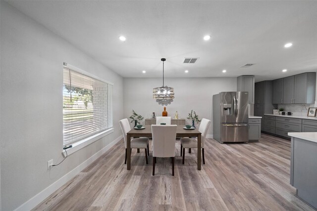 dining area with light hardwood / wood-style floors