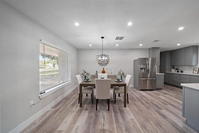 dining space with light wood-type flooring