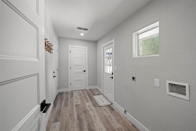 doorway to outside featuring light wood-type flooring