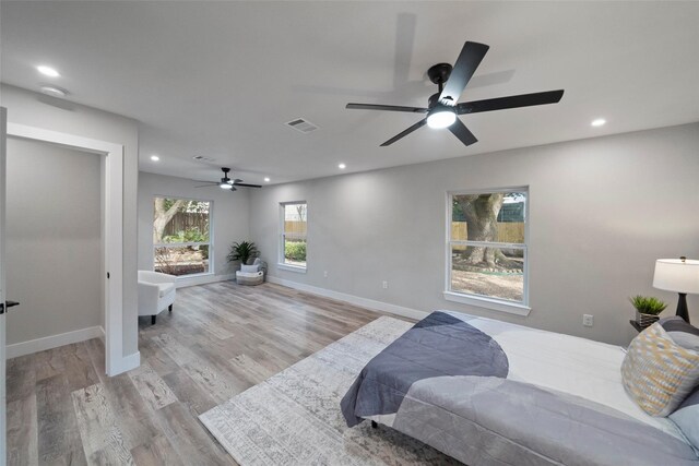 bedroom featuring light wood-type flooring and ceiling fan