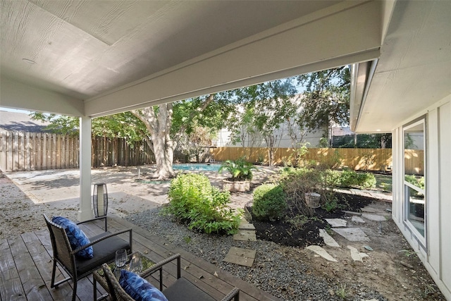 view of patio with a fenced in pool