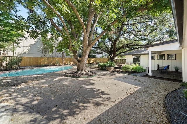 view of yard featuring a patio area and a fenced in pool