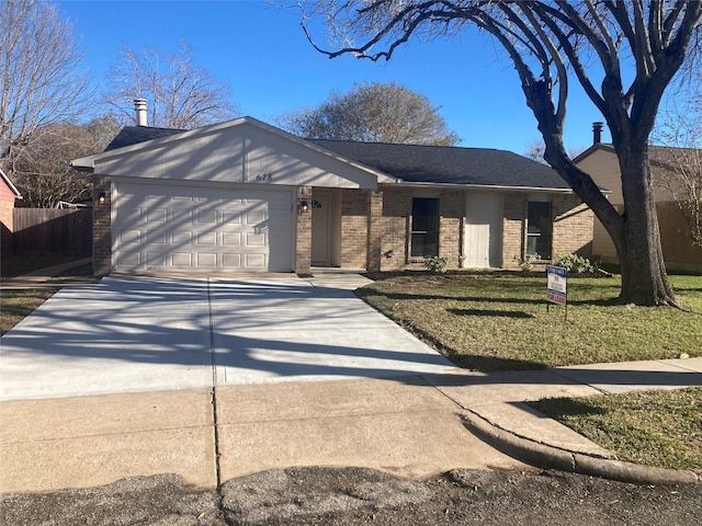 ranch-style house featuring a front lawn and a garage