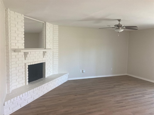 unfurnished living room with a fireplace, hardwood / wood-style floors, and ceiling fan