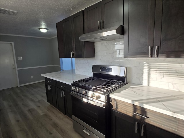 kitchen with light stone countertops, a textured ceiling, dark brown cabinetry, hardwood / wood-style floors, and stainless steel range with gas stovetop