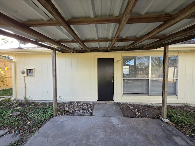 entrance to property with a patio area