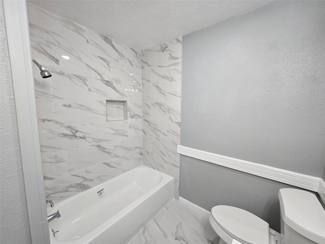 bathroom featuring toilet and shower / washtub combination