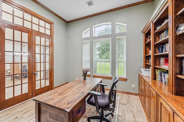 office with crown molding, french doors, and light hardwood / wood-style floors