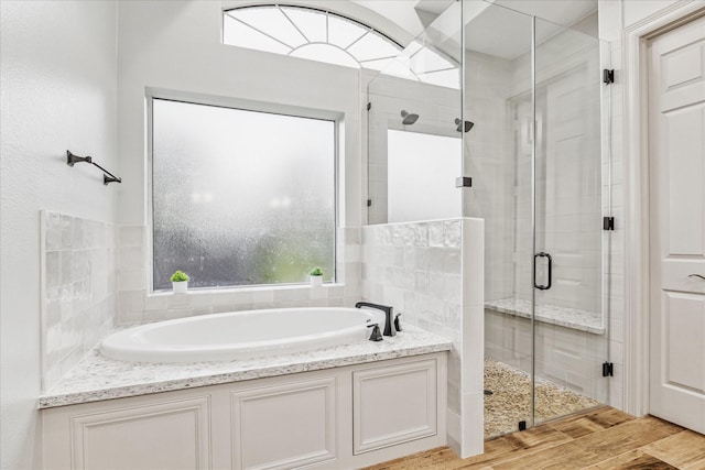 bathroom featuring plus walk in shower