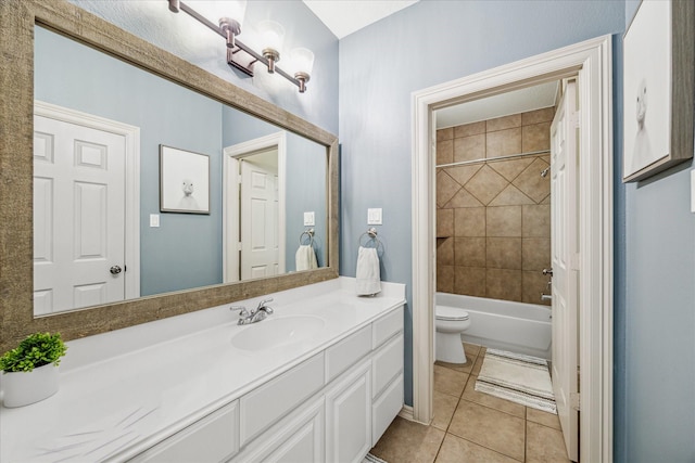 full bathroom featuring tile patterned flooring, vanity, tiled shower / bath combo, and toilet