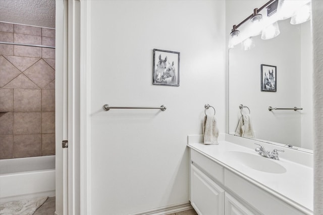 bathroom featuring vanity and a textured ceiling