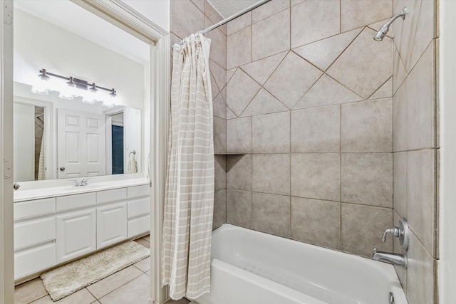 bathroom featuring tile patterned floors, vanity, and shower / tub combo