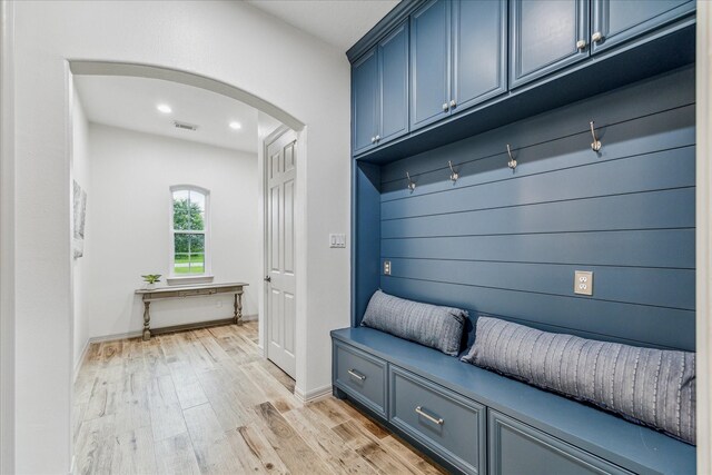 mudroom with light hardwood / wood-style flooring