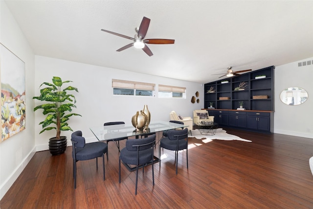 dining room with ceiling fan, dark hardwood / wood-style flooring, and lofted ceiling