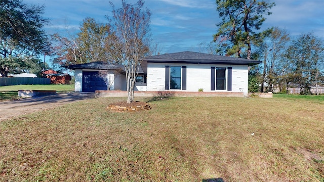 single story home with a front lawn and a garage