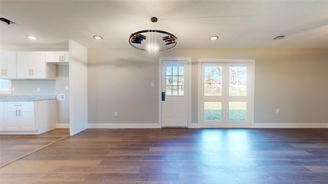 doorway to outside featuring dark hardwood / wood-style flooring