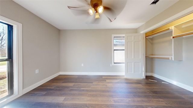 unfurnished bedroom with a closet, ceiling fan, and dark hardwood / wood-style floors