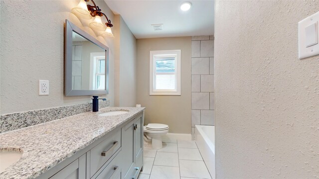 bathroom featuring tile patterned floors, vanity, and toilet