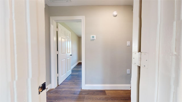 corridor featuring dark hardwood / wood-style floors