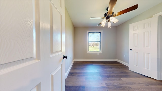 unfurnished bedroom featuring ceiling fan and dark hardwood / wood-style flooring