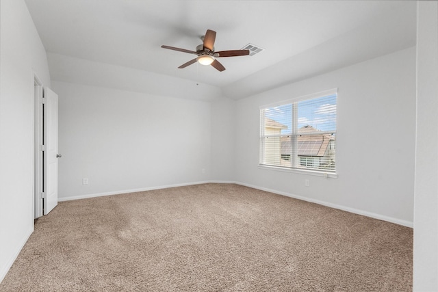 empty room with ceiling fan and carpet flooring