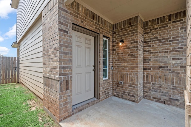 doorway to property with a patio area