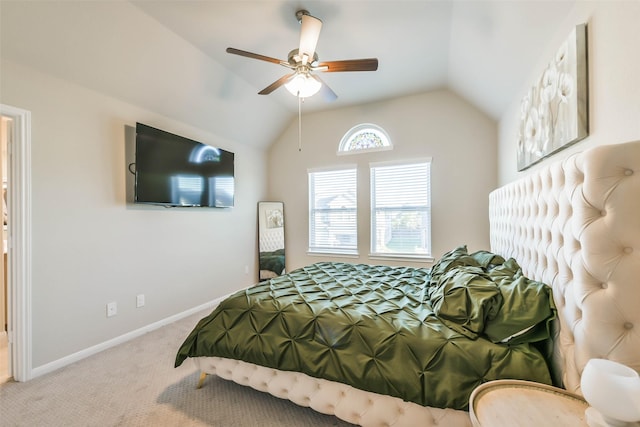 bedroom with carpet flooring, ceiling fan, and vaulted ceiling