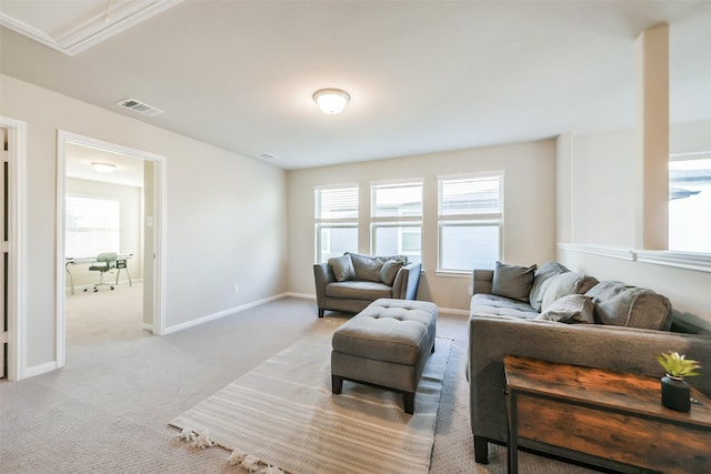 living room with light carpet and crown molding