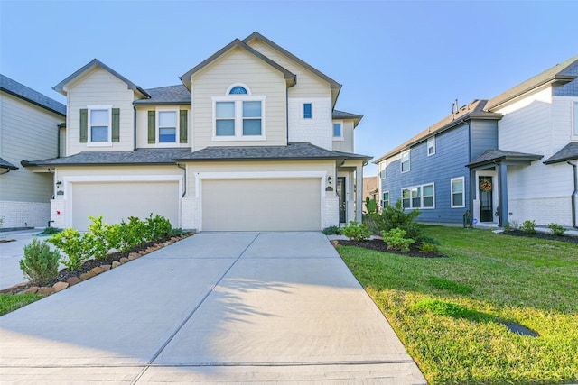 view of front of home featuring a garage and a front lawn