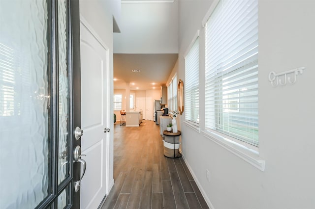 hall with dark hardwood / wood-style flooring