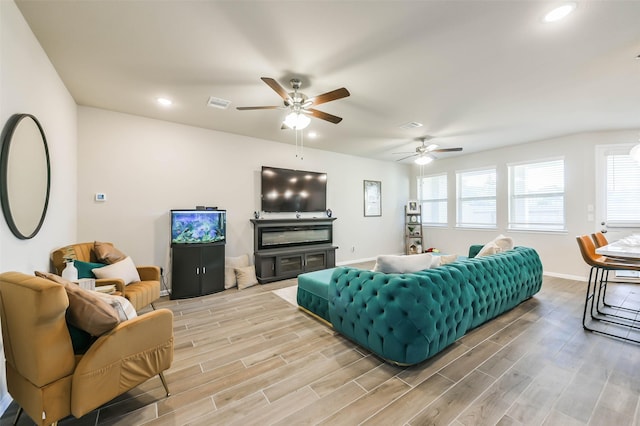 living room featuring ceiling fan