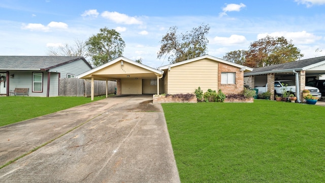 ranch-style home with a front lawn and a carport