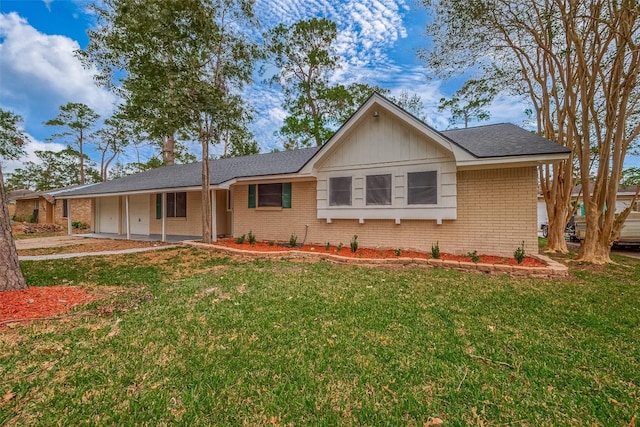 single story home with covered porch and a front yard