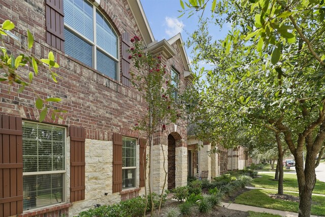9147 Monarch Mist Ln, Houston, TX 77070 - view of home's exterior featuring stone siding
