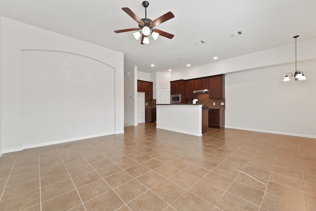 unfurnished living room with light tile patterned floors and ceiling fan with notable chandelier