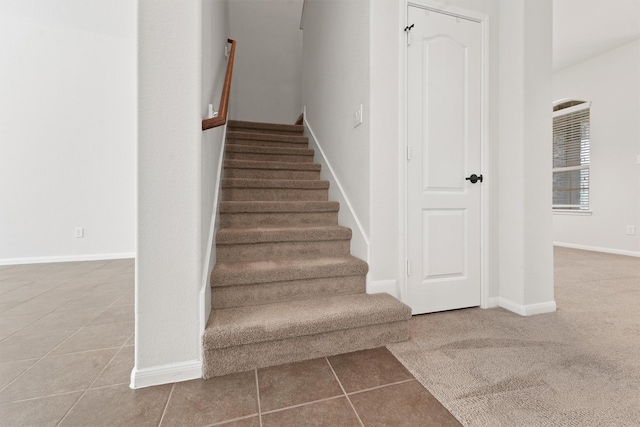 staircase with tile patterned flooring