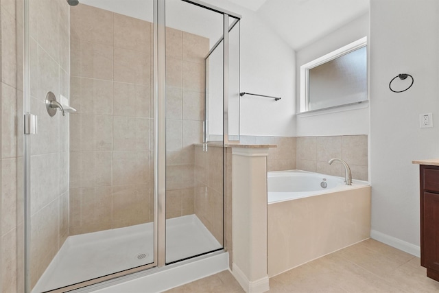 bathroom featuring separate shower and tub, tile patterned floors, vanity, and lofted ceiling