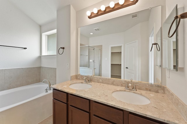 bathroom with vanity and plus walk in shower