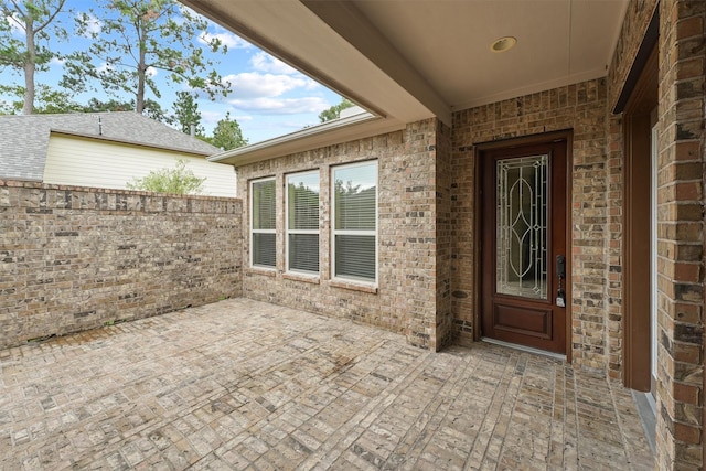 doorway to property with a patio area